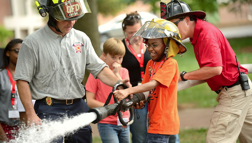 The Oxford fire department helps Math Camp attendees learn about real world math applications. 