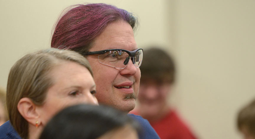 John O'Haver watches students participate in the FIRST Tech Challenge.